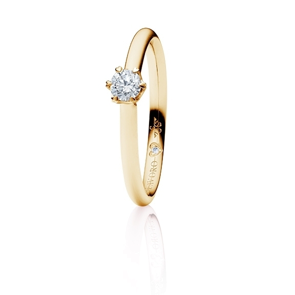 Ring "True Love" 750GG 6-er-Krappe mit seitl. WG-Herz, 1 Diamant Brillant-Schliff 0.25ct TW/si, 1 Diamant Brillant-Schliff 0.005ct TW/vs1